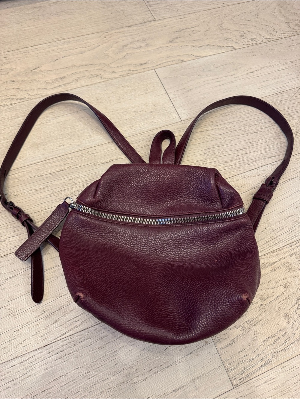 Pebbled Leather Round Backpack in Deep Burgundy